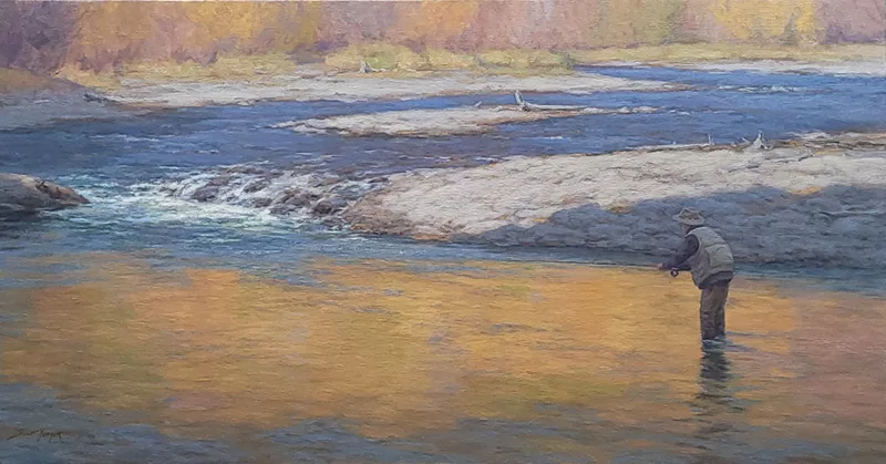 Fly Fisher casting in the river