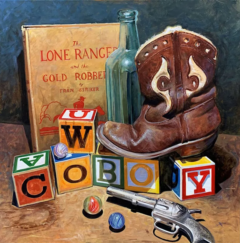 Still life with a cowboy boot, blocks spelling out cowboy, a copy of "The Lone Ranger and the Gold Robber," and a cap gun.